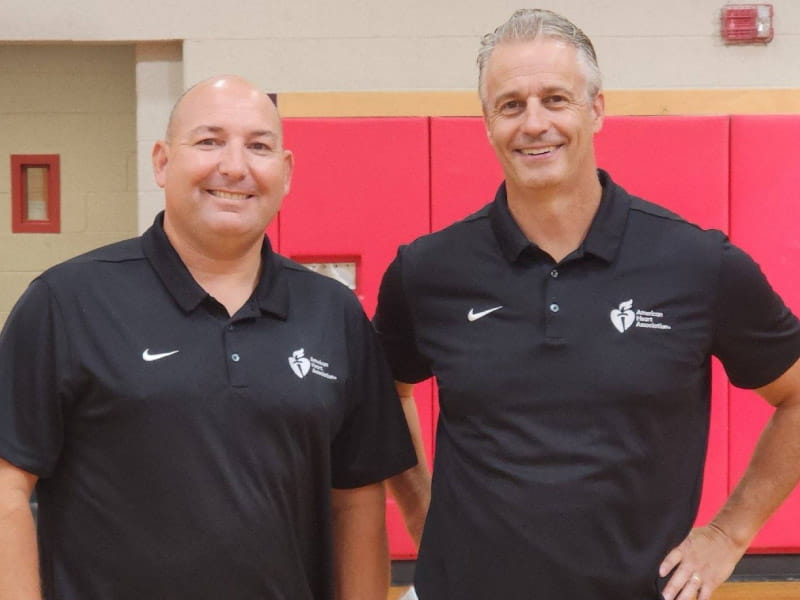 Since 1998, physical education teachers Jason Feid (left) and John Dempsey of North Attleboro Middle School in Massachusetts have run the school's annual educational event and fundraiser benefiting the AHA. In 2023, their efforts earned them the Outstanding Team of the Year award from the AHA. (Photo courtesy of Jason Feid)