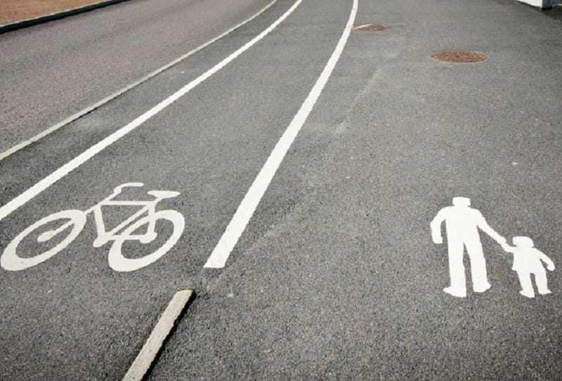 Complete Streets policies change how cities design roadways to ensure safe transit for all people, including those who are walking, biking, driving, using wheelchairs and other assist devices, and riding public transit. (AHA photo illustration)