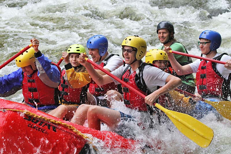 With river guide at the rear, Donald Lloyd-Jones (third from left), wife Kathleen (at left), children Caroline (second from left), Adam (fourth from left) and Cameron (at right), and Aria Szalai-Raymond tackle whitewater in the Hudson River Gorge in New York state in 2015. (Courtesy of Donald Lloyd-Jones)