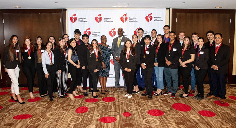 At center, Stacey Ingram, senior manager for networked initiatives for Quest Diagnostics’ Quest for Health Equity (Q4HE), and Mandell Jackson, Q4HE vice president and general manager, with the inaugural cohort of Hispanic Serving Institutions Scholars during the AHA Research Symposium at the University of Houston in Texas in April. (AHA)