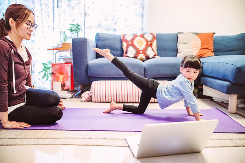Mom and daughter exercising at home