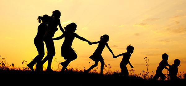 silhouetted kids running at sunset silhouetted kids running at sunset