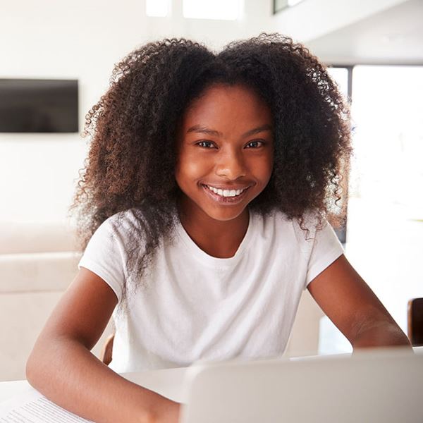 happy young girl using laptop