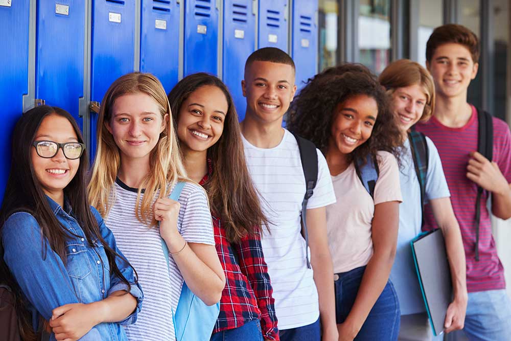 students standing in front of lockers