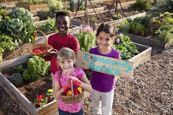 diverse kids smiling in gardens