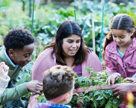 Teacher in a Teaching Garden with students