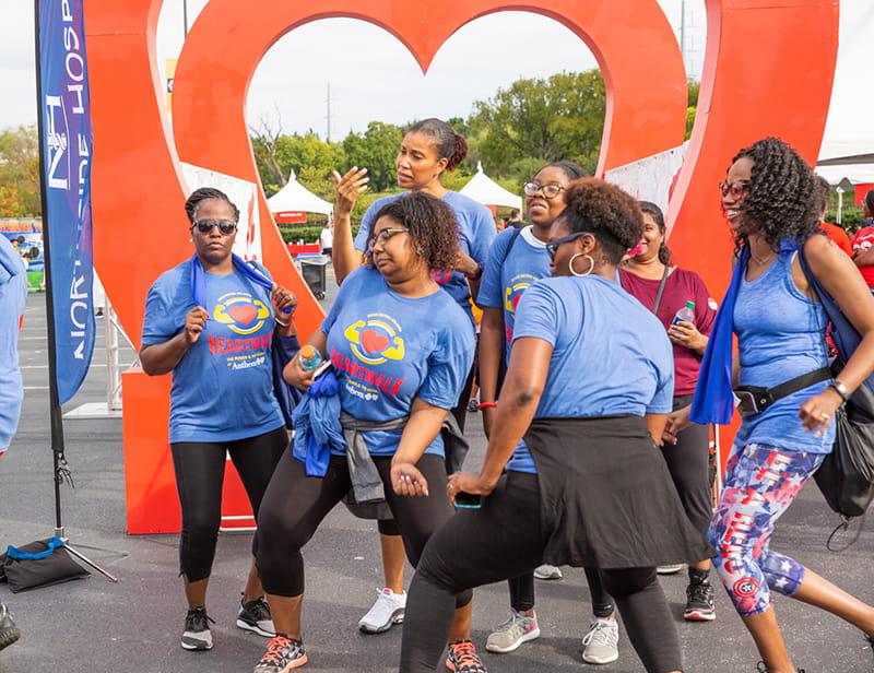 group dancing at Heart Walk finish line