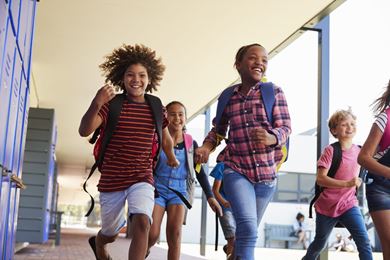 children running in schoolyard