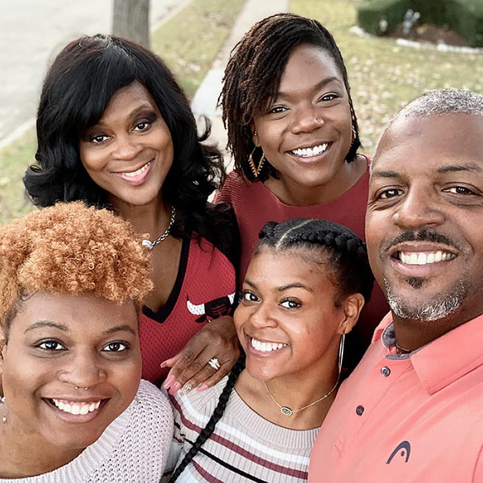 Darryl Griffin and four family members posing together outside for a selfie