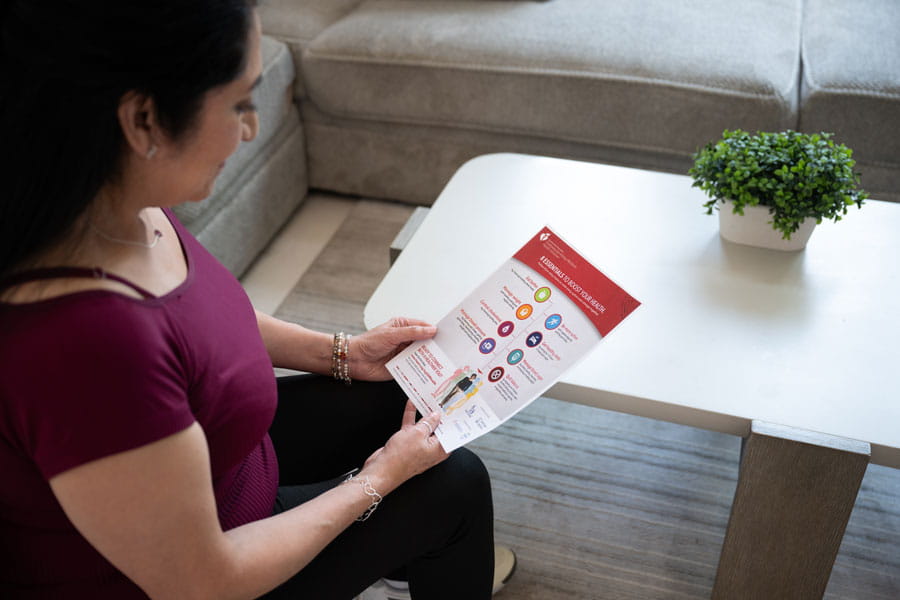 Woman looking at a health fact sheet