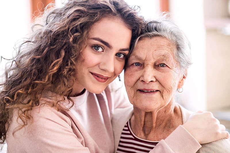 portrait of young woman with grandmother