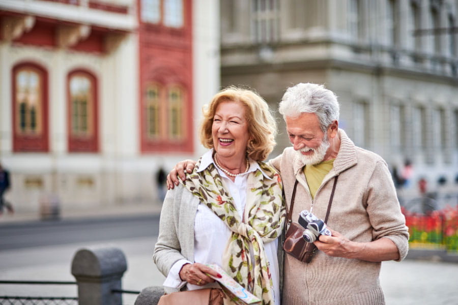 Couple with map and camera on vacation