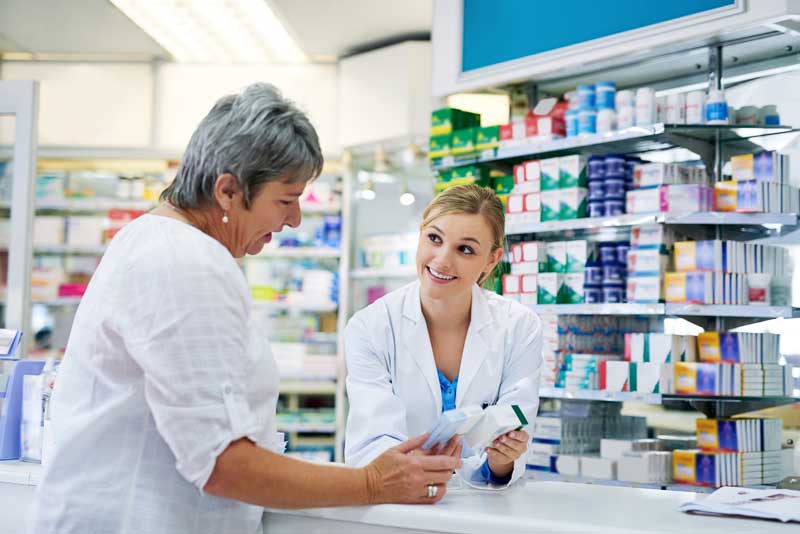 pharmacist talking to customer