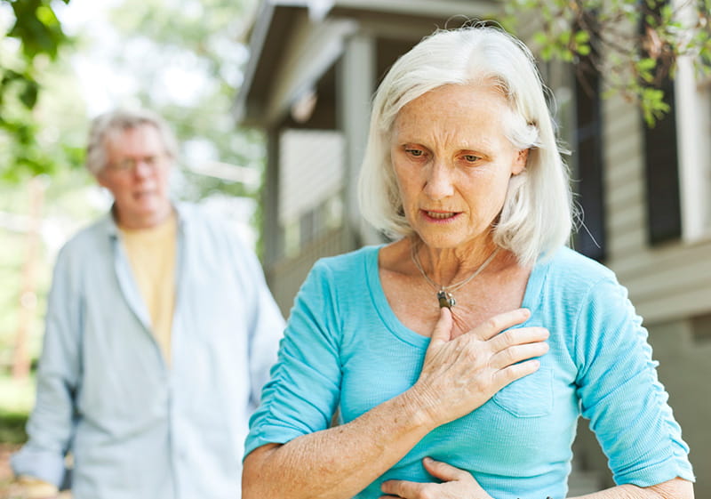 senior woman with chest pain