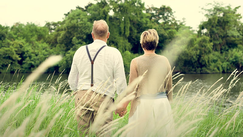 couple walking in a field