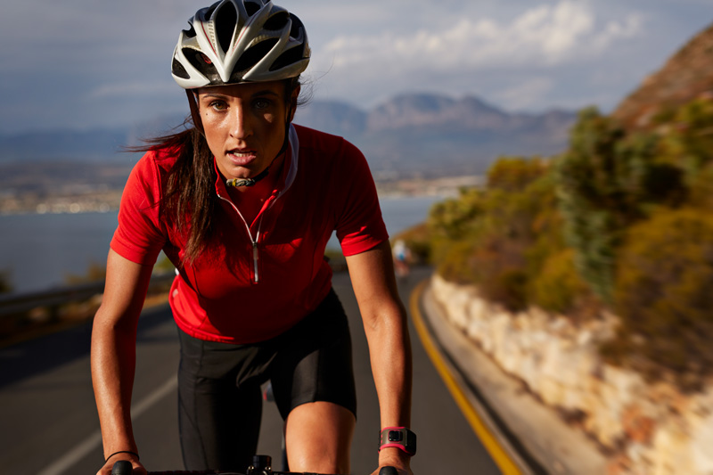 Female biking on highway