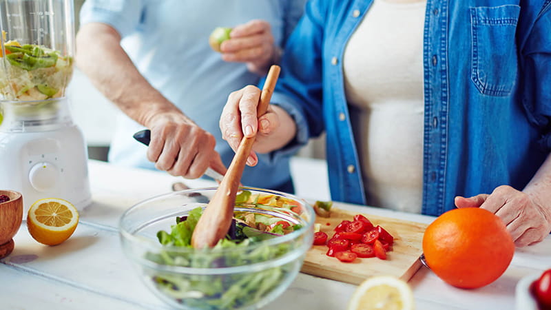 mixing salad ingredients close up