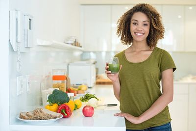 woman holding smoothie