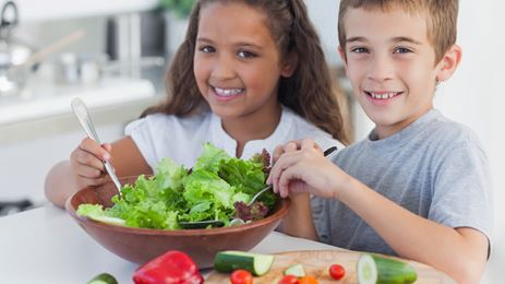 Kids making salad