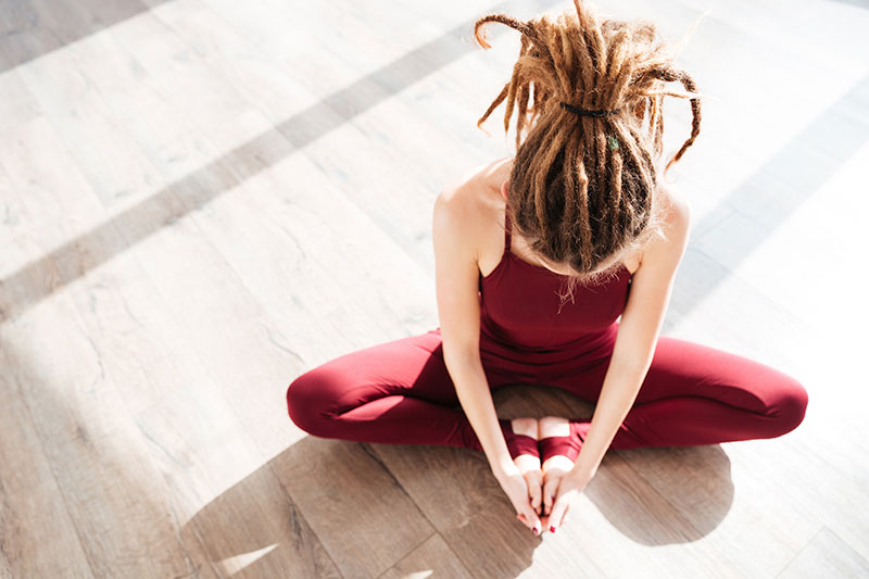 flexible woman with dreadlocks sitting mother and daughter hug