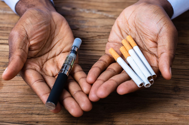 https://www.heart.org/-/media/Images/Healthy-Living/Healthy-Lifestyle/hands-holding-a-vape-pen-and-cigarettes.jpg