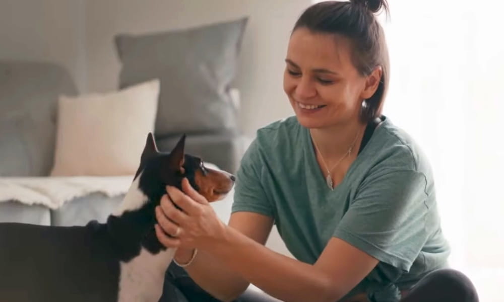 woman petting dog