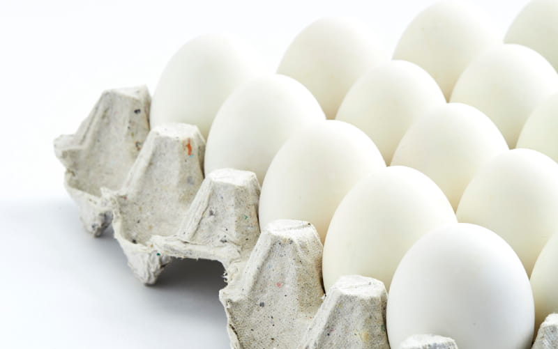 Photo of a dozen white eggs