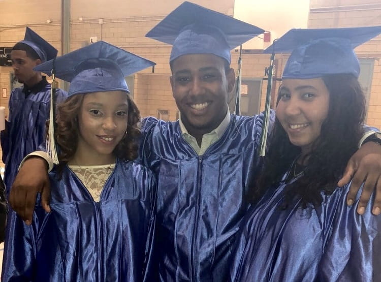 Recent high school graduates Genesis Ortiz (left) and Yuneidy Grullon (right) witnessed Anthony Rosa Compres (center) use his CPR skills to save a life. (Photo courtesy of Anthony Rosa Compres)