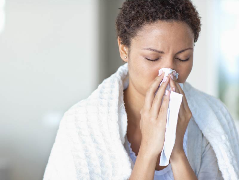 Woman sick with flu.