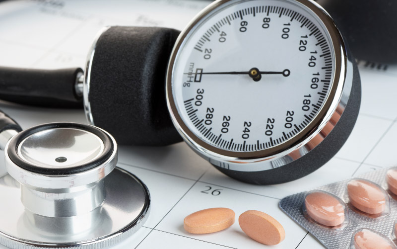 Blood pressure cuff and meds. (iStock)