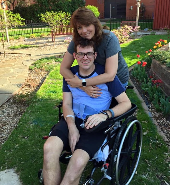 Christian with mom, Marla, his first day outdoors during stroke rehabilitation. (Photo courtesy of Christian England-Sullivan)
