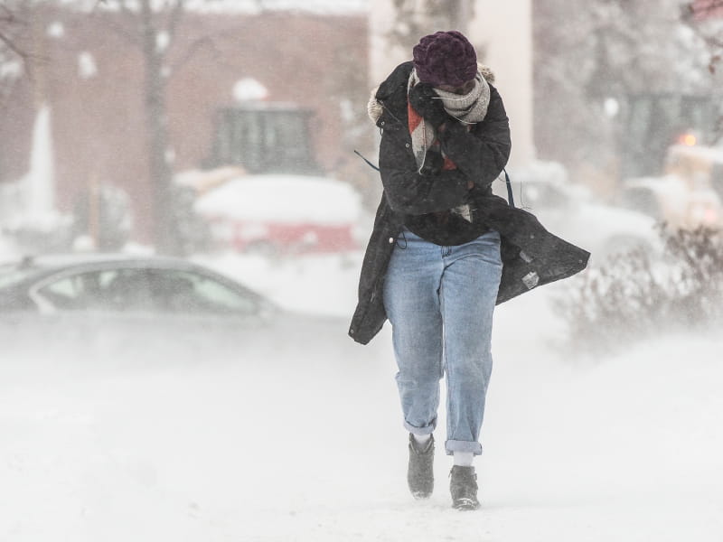 Woman walking through cold.