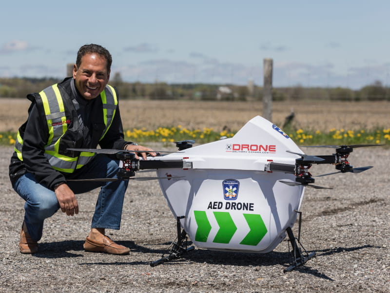 Dr. Sheldon Cheskes, medical director at the Sunnybrook Center for Prehospital Medicine in Toronto, with an AED drone. (Photo courtesy of Drone Delivery Canada)