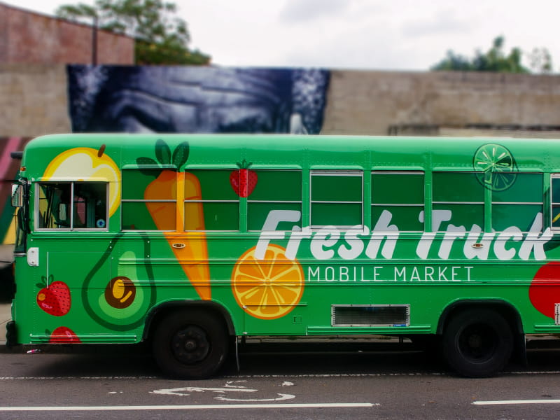 One of the retrofitted Fresh Truck school buses that carries fresh, affordable produce to communities in need. (Photo courtesy of About Fresh)
