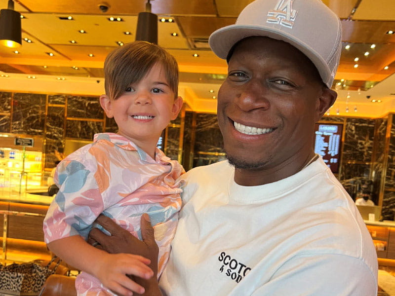 Los Angeles Rams defensive coordinator Raheem Morris (right) with Wyatt Stanley, the 3-year-old Morris helped save from drowning. (Photo courtesy of Nicole Morris)