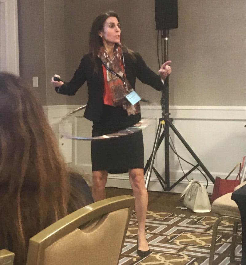 Dr. Beth Frates hula-hoops at a health care conference where she led a session on wellness in 2017. (Photo courtesy of Amy Comander)
