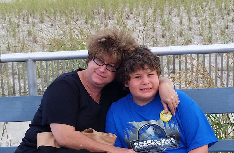 Debra Wallace (left) and her son Adam sitting outside together