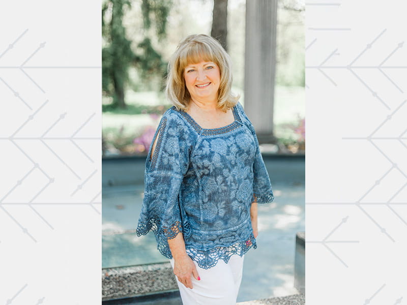Natalie Daugherty posing outside and smiling