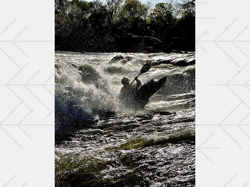 Nick Troutman paddling in his kayak along the Chattahoochee River in Columbus, Georgia
