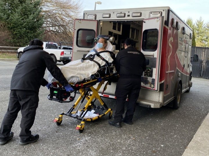 Yutao Huang being rolled into the ambulance