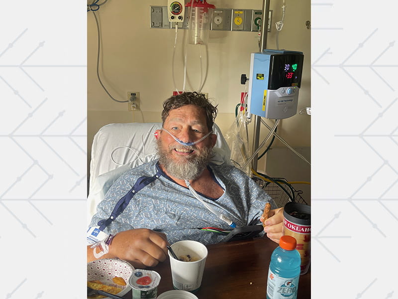 Bruce enjoying a meal in the hospital not long after doctors removed his breathing tube