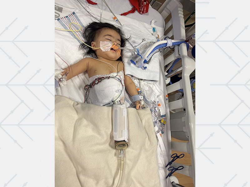 Aaliyah with her ventricular assist device on her blanket at Children's Hospital Los Angeles