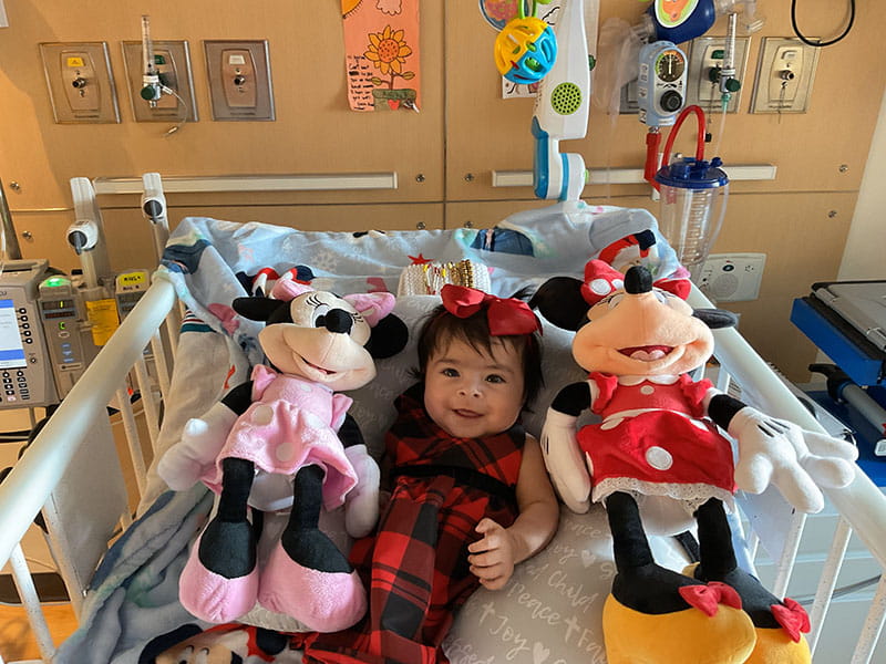 Aaliyah and her Minnie Mouse dolls in her room at Children's Hospital Los Angeles