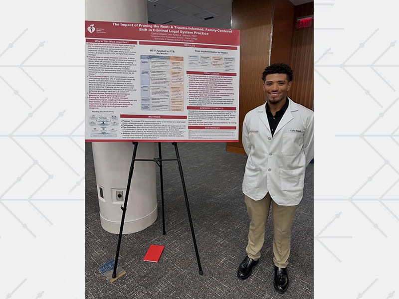 Delgado presenting his research at an AHA Scholars symposium in Atlanta.