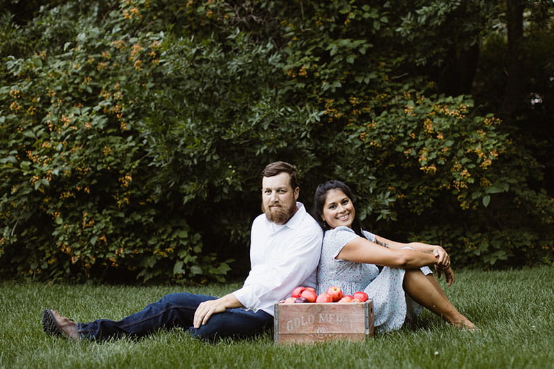 Marcella Prokop posing with husband, Sean McFarland, in a grassy field