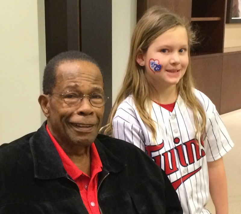 Rod Carew with a young fan.