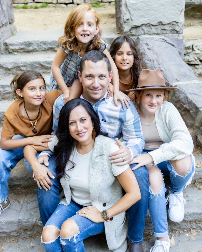 Nick Reed (center) with his family. Clockwise from left: Daughters Lis'e, Corrie, Charlie, Amy, and wife, Rachel. (Photo courtesy of Matthew Watson Photography)