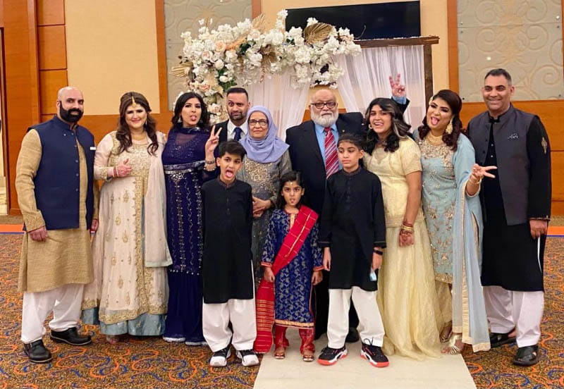 Farah Siddiqi (second from right) and her dad, Qamar Masood (fourth from right), with family in Dubai a week before the pilgrimage. (Photo courtesy of Farah Siddiqi)