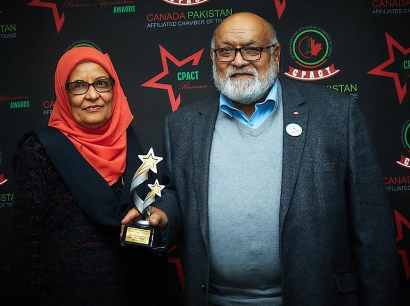Qamar Masood (right) with his wife, Sadaf, at a ceremony in Canada where he received an award for volunteering. (Photo courtesy of Farah Siddiqi)