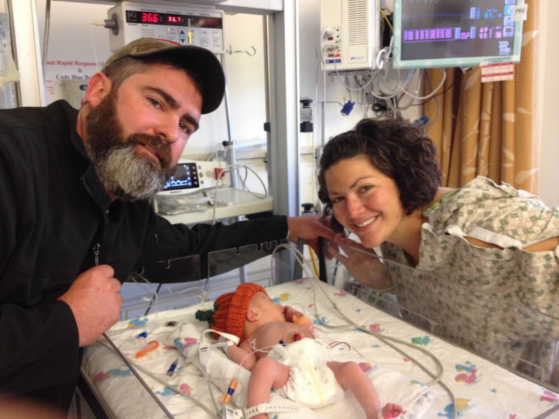 Stephanie (right) and Dan Jenness in the hospital with their newborn daughter, Corey, in 2017. (Photo courtesy of the Jenness family)
